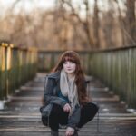 ‘근육이 건강을 지킨다’…일상 속 근력 챙기는 실천법 주목 woman sitting on wooden bridge