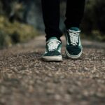 직장인을 위한 건강 관리, 일상에서 쉽게 실천하는 최신 트렌드 a person standing on a gravel road with their shoes on