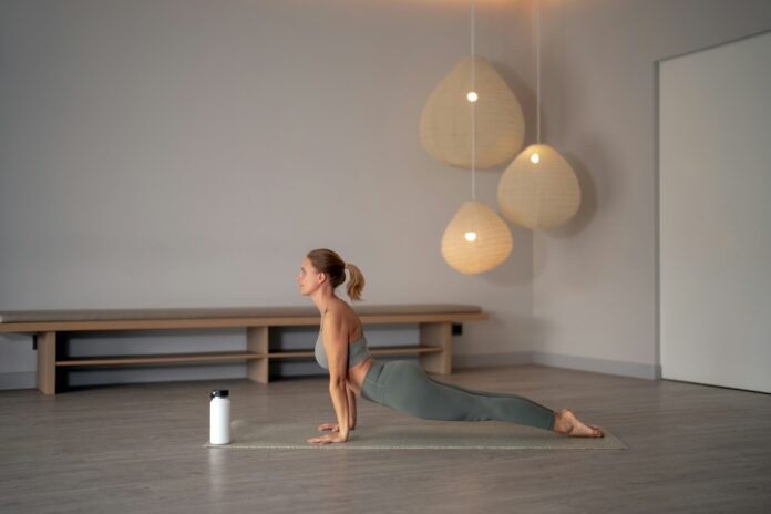 Photo by Anna Rosar a woman doing yoga